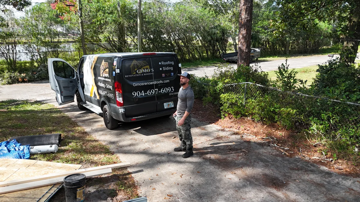 Gimo's Roofing owner with company van Gimo's Roofing owner with company van