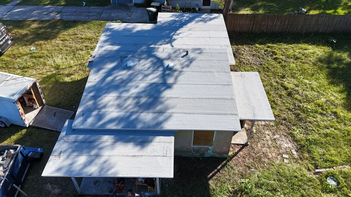 Metal roof installation in Jacksonville FL Flat metal roof installation on a Jacksonville FL property