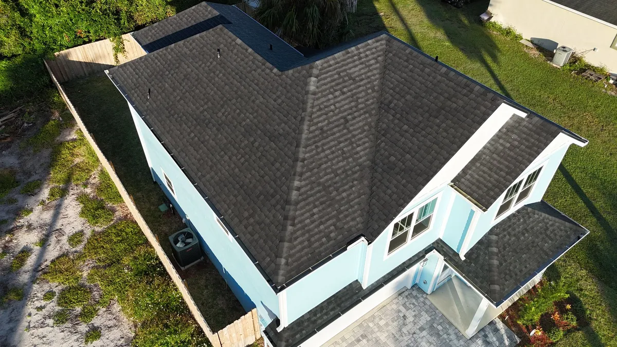 Light Blue House Roof - St. Augustine FL Light blue house with dark shingle roof in St. Augustine FL