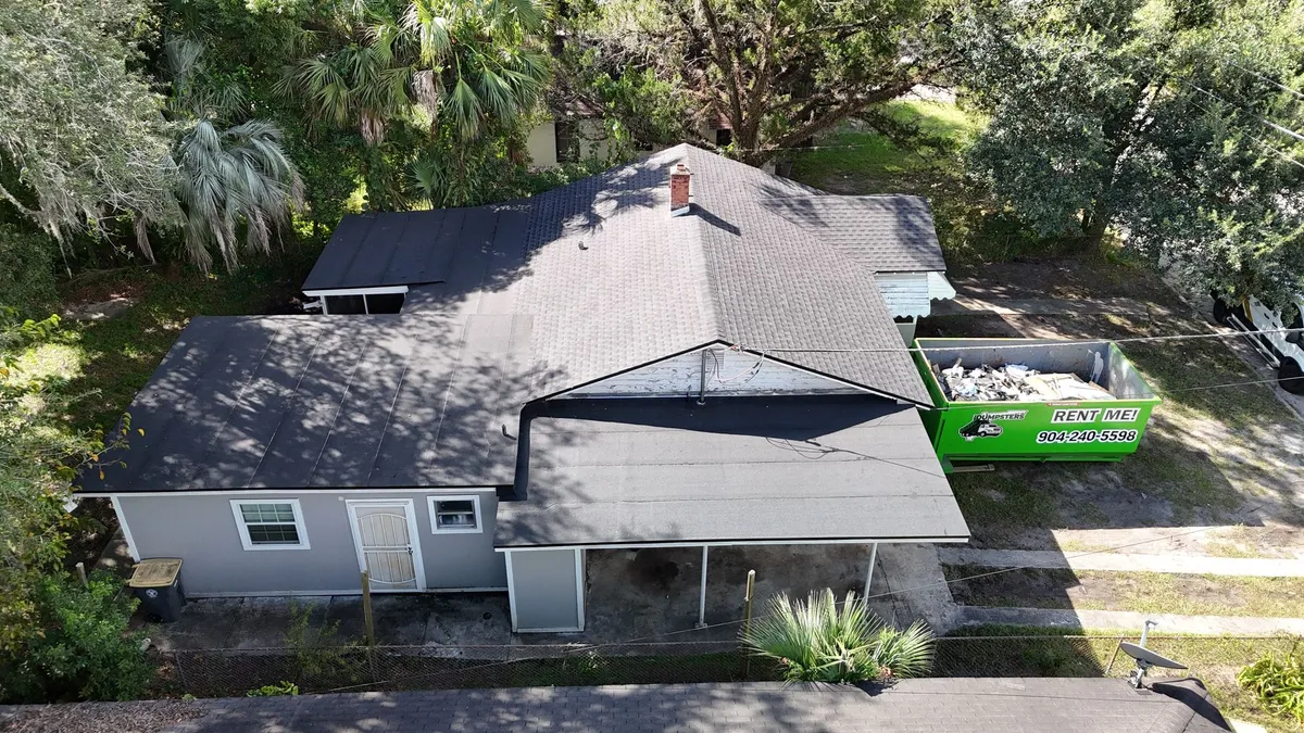 Roof Replacement Project - Jacksonville FL Roof replacement project with debris removal dumpster Jacksonville FL